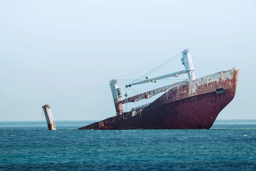 Shipwreck representing avoiding the sunk cost fallacy in software development, illustrating the need to move past unsuccessful projects.