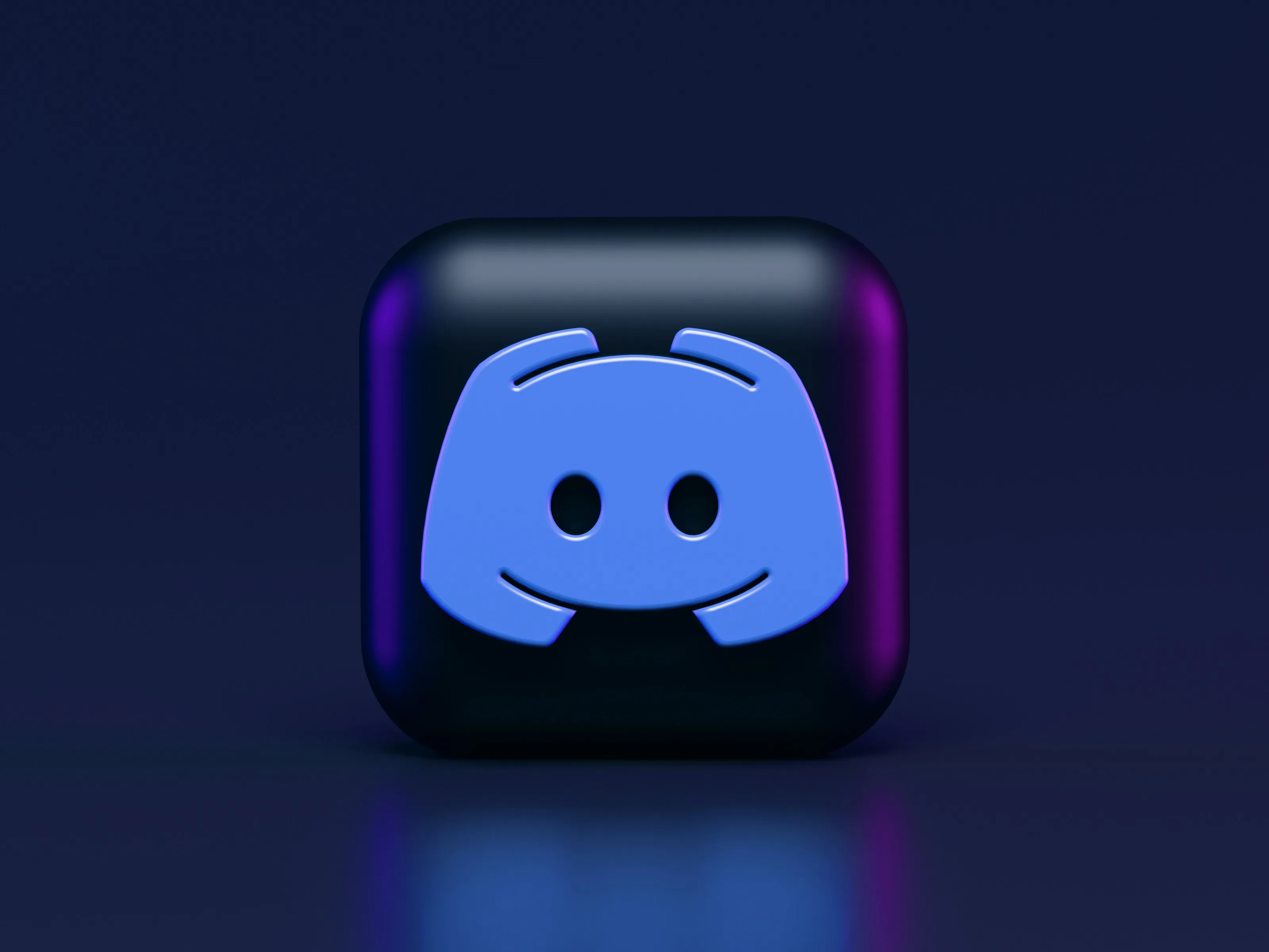 3D icon of Discord app on a sleek dark background, symbolizing the first step on how to build a simple Discord bot.