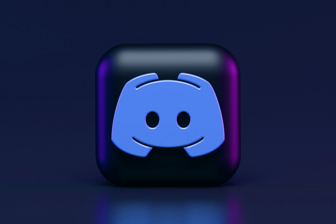 3D icon of Discord app on a sleek dark background, symbolizing the first step on how to build a simple Discord bot.