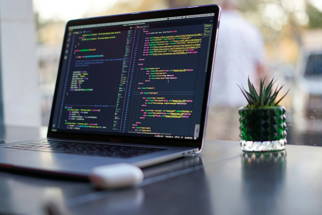 Laptop displaying code, illustrating the use of Rich Python library for interactive CLI tools to create advanced and visually appealing command-line interfaces.
