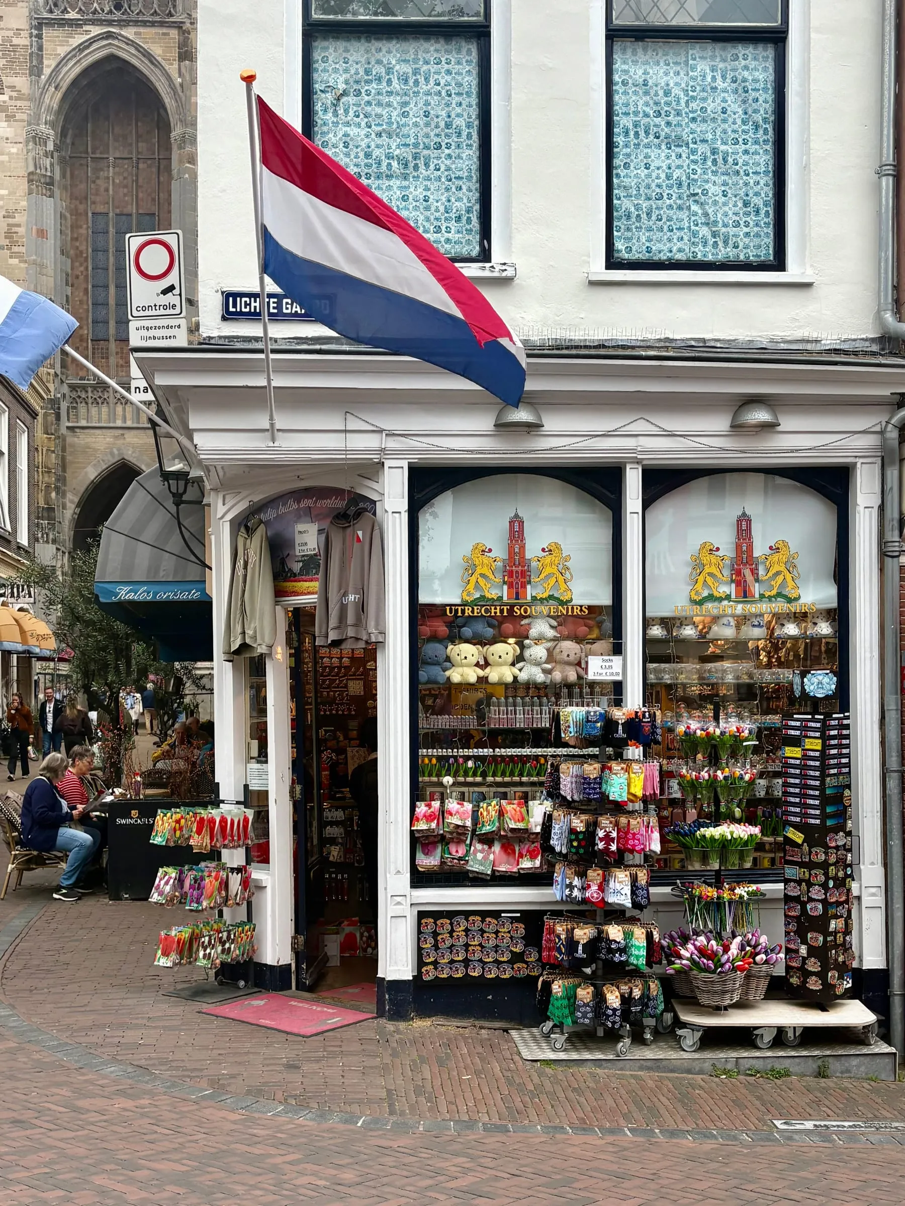 A souvenir shop in Utrecht with the Dom Tower behind it