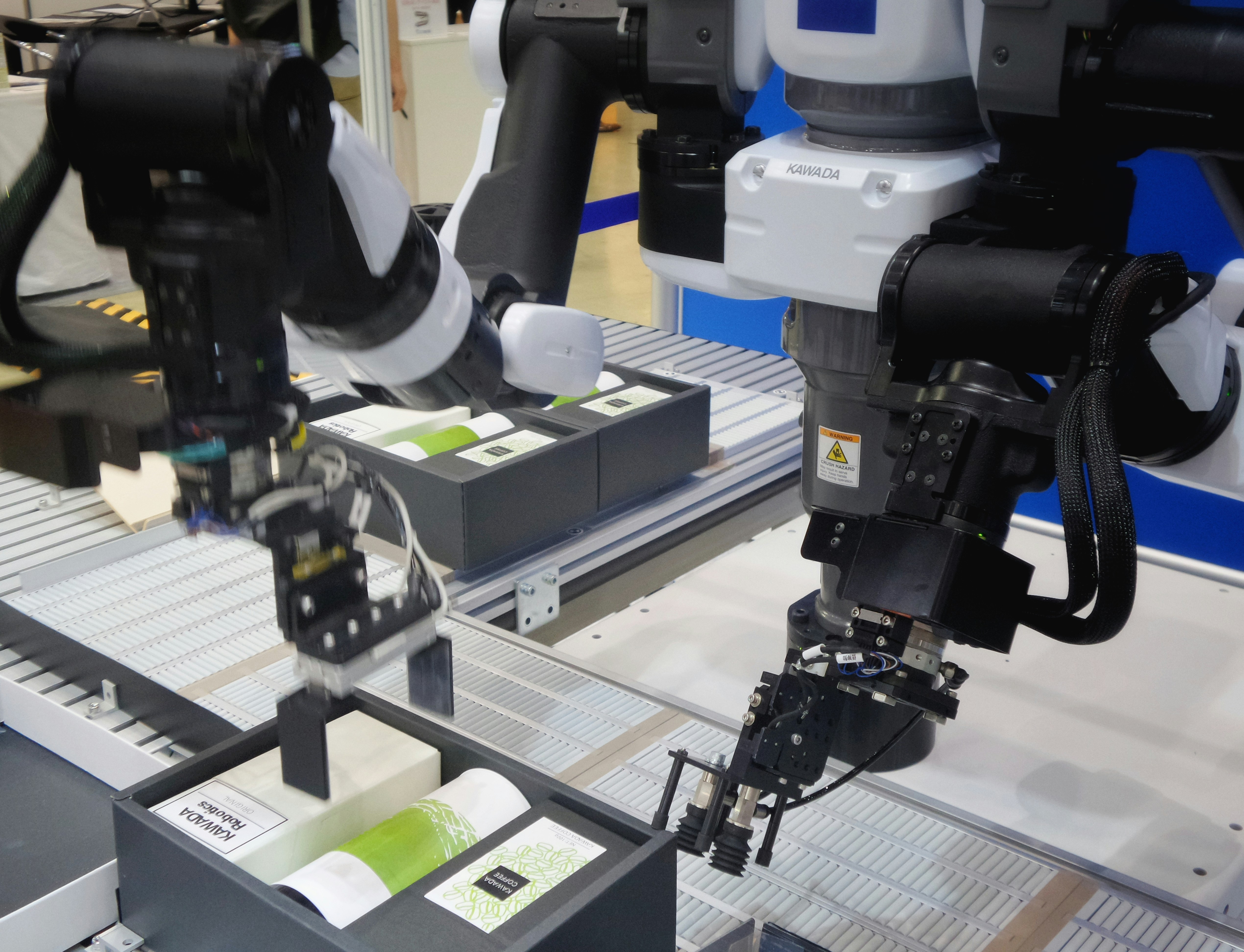 Industrial robotic arms utilizing advanced programming techniques on a production line, highlighting precision and efficiency in manufacturing settings, relevant to discussions on the best Python serialization modules for data handling in automation.